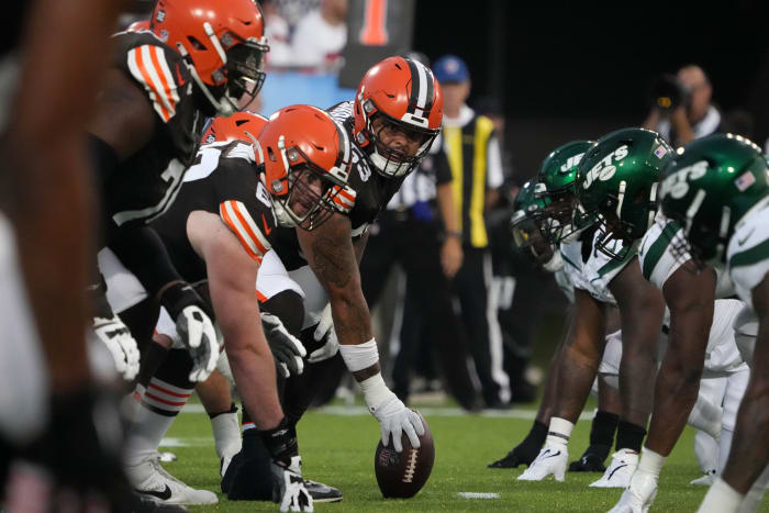 Aug 3, 2023; Canton, Ohio, USA; A general overall view of helmets at the line of scrimmage as Cleveland Browns center Nick Harris (53) snaps the ball against the New York Jets during the first half at Tom Benson Hall of Fame Stadium. Mandatory Credit: Kirby Lee-USA TODAY Sports